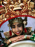 Portrait of a Young, Legong Dancer Posing on Decorative Gong, Peliatan, Indonesia Photographic Print by Adams Gregory