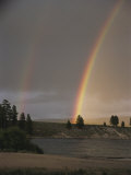 Two Rainbows Arcing over a Body of Water Photographic Print by Stephen Sharnoff