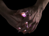 Lightning Bolts Illuminate Two Hands Photographic Print by Martin Paul
