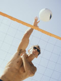 Low Angle View of a Young Man Playing Volleyball Photographic Print