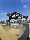Rollerblader Perfoming Trick on Ramp Photographic Print
