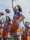 Side Profile of Cheerleaders with Pom-Poms Photographic Print