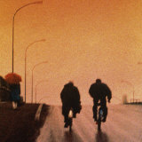 Bicycling Down Street Photographic Print