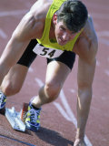 Close-up of a Young Man in the Starting Position on a Running Track Photographic Print