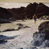 Young Man Running on the Beach Photographic Print