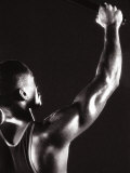 Male Runner Holding Up a Relay Baton Photographie