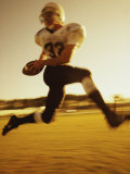 Football Player Running with The Ball Photographic Print