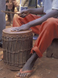 Playing a Congolese Drum in a Congolese Refugee Camp, Tanzania Photographic Print by Kristin Mosher
