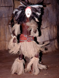 Ostrich Feather Masked Dancer, Victoria Falls, Zimbabwe Photographie par Claudia Adams