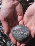 Person Holding Rock with the Word Blessings Fotografická reprodukce