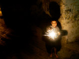 A Palestinian Boy Holds a Sparkler after Breaking the Fast on the First Day of Ramadan in Gaza City Photographie