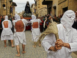 Several Masked Penitents Beats Their Backs During "Los Picaos" Brotherhood Procession Photographic Print