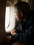 President Bush Looks out the Window of Air Force One Over New Orleans Photographic Print