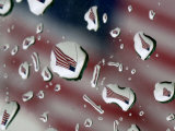 A Flag at a Lawrence, Kan., Restaurant is Refracted in Rain Drops on a Car Window Photographic Print
