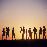 Large Family Silhouetted by Sunset Photographic Print