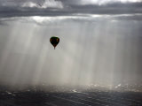 A Lone Balloon Drifts Near the Foothills of Albuquerque, N.M. Photographic Print