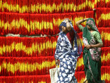 Villagers Walk Past Freshly Dyed Kalawa, a Sacred Orange-Yellow Thread Used in Hindu Rituals Photographic Print