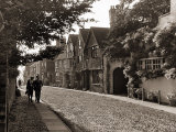 Couple Walking Down a Quiet Cobbled Road in Rye Sussex Photographic Print