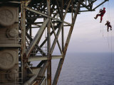 Remote Access Technicians Dangle off Ropes on an Oil Rig Photographic Print by Justin Guariglia