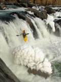 Kayaker Over Frozen Falls in Winter Photographie par Skip Brown