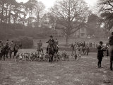 Hunting Men Riding Horses with a Pack of Hounds Photographie