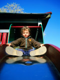 Boy on Slide, Copenhagen, Denmark Photographic Print by Martin Lladó