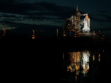 The Space Shuttle Atlantis is Reflected in a Pond on Pad 39B Photographic Print