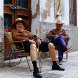 Elderly Couple Relaxing Outside Their House, Palma De Mallorca, Spain Photographic Print by Christian Aslund