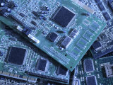 Computer Boards and Chips Lie in a Pile Photographic Print by Taylor S. Kennedy