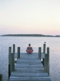 A Seagull Watches a Woman Practice Yoga on a Dock Photographic Print by Taylor S. Kennedy