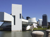 A Ring-Billed Gull Takes Flight in Front of the Rock and Roll Hall of Fame and Museum Photographic Print