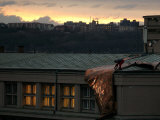 A Worker Cuts a Piece off a Roof That was Torn Away During a Storm in Prague, January 19, 2007 Photographie par Petr David Josek