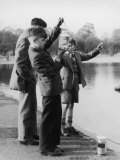 Boys in Their School Uniform Inspect Their Jam Jar Full of Little Fish Photographie