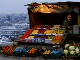 A Palestinian Fruit and Vegetable Vendor Waits for Customers Photographic Print by Kevin Frayer