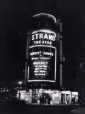 The Strand Theatre, London is Lit up at Night to Advertise the Play Maigret Starring Rupert Davies Photographic Print