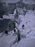 Climbers Crossing Ladder on Everest, Nepal Posters by Michael Brown