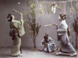 Young Geishas in Traditional Costume Playing 'Hanetuki' Photographic Print