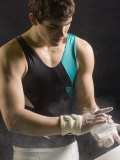 Male Gymnast Putting Chalk on his Hands, Bainbridge Island, Washington State, USA Photographic Print