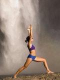 Young Woman Practicing Yoga on a Rock, Snoqualmie Falls, Washington State, USA Photographic Print