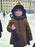 A Young Girl Holds Up Four Fingers to Signal Her Age Photographic Print by Dean Conger