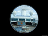 Looking Down on the Pool Deck of a Cruise Ship Through a Porthole Lámina fotográfica