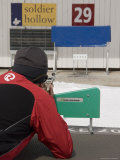 A Man Shoots at a Target in the Distance During a Biathalon Photographic Print by Taylor S. Kennedy