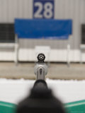 A Rifle Points at a Target on a Range at a Biathalete Center Lámina fotográfica A Rifle Points at a Target on a Range at a Biathalete Center Lámina fotográfica