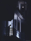 An Old Man is Silhouetted on the Balcony of His Apartment in the Old City of Cartagena Photographic Print