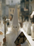 Masked Penitent Photographed During an Easter Celebration Photographic Print by Thomas J. Abercrombie