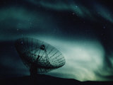 A Satellite Dish Silhouetted against the Northern Lights Photographic Print