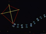 A Red and Yellow Neon Kite with a Blue Tail Photographic Print