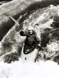 Kayaker Katherine Haines careens over a waterfall into the swirling white water below Photographie