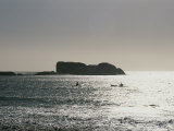 Kayakers Enjoy the Water off the Coast of the Clifton Photographic Print