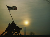 Silhouetted View of the Iwo Jima Memorial with the Capitol and Washington Monument Behind Photographic Print by Anthony Peritore